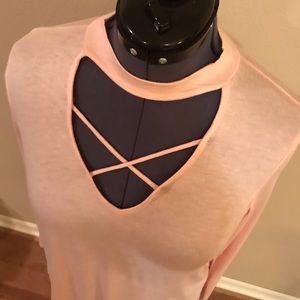 Mock neck, keyhole, crisscross long sleeve top.